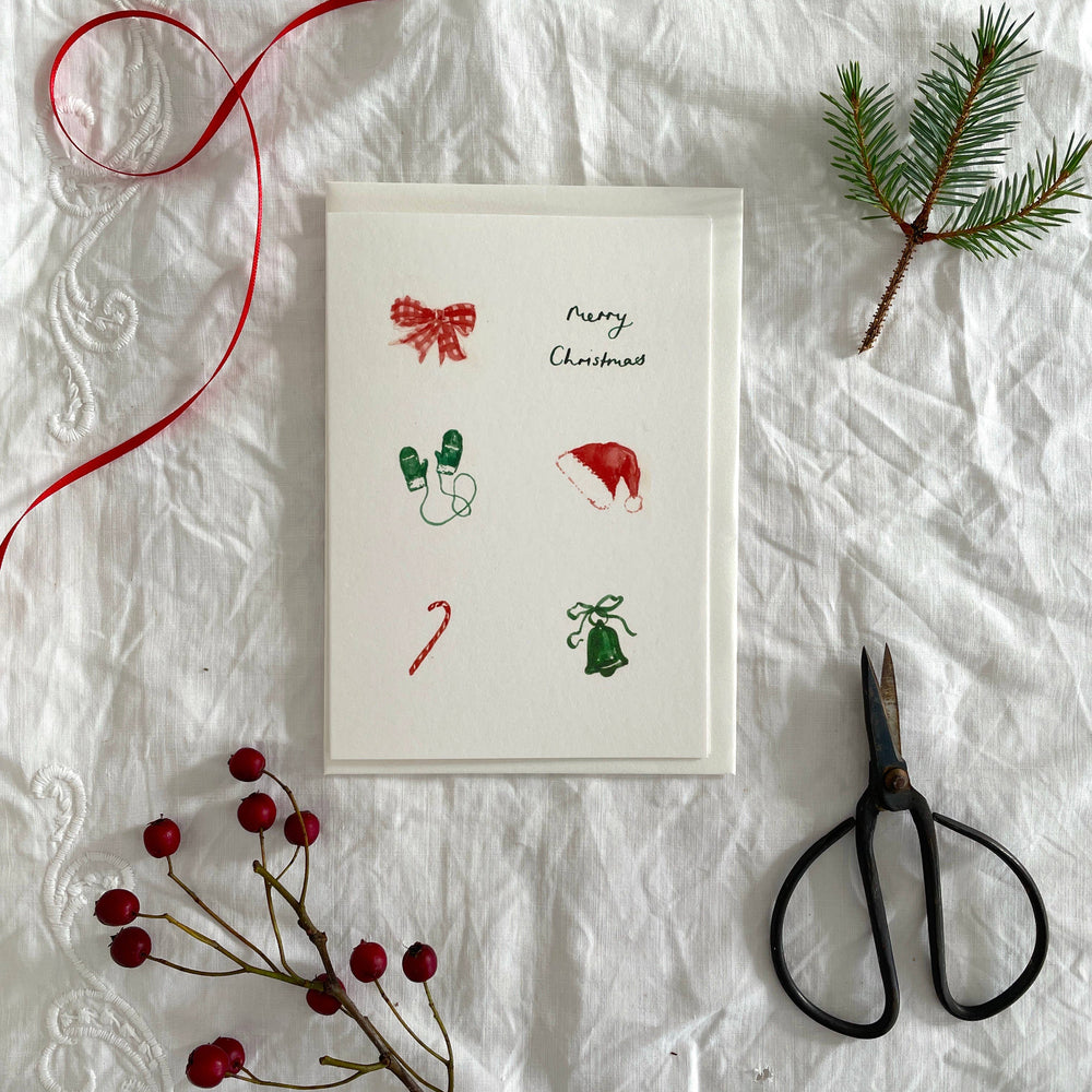 
                      
                        Bow, Mittens, Candy Cane and bell Luxury 'Merry Christmas' Card
                      
                    