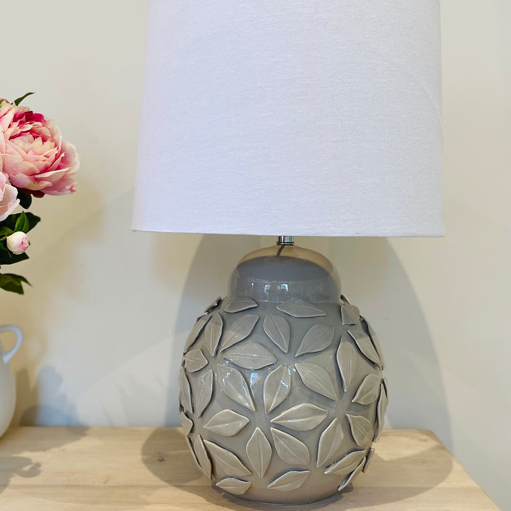 
                      
                        The Fleur Ceramic Grey Lamp & White Linen Shade
                      
                    