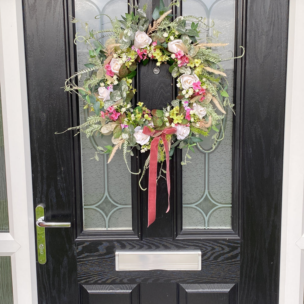 
                      
                        Pink Blushes Faux Flower Wreath
                      
                    