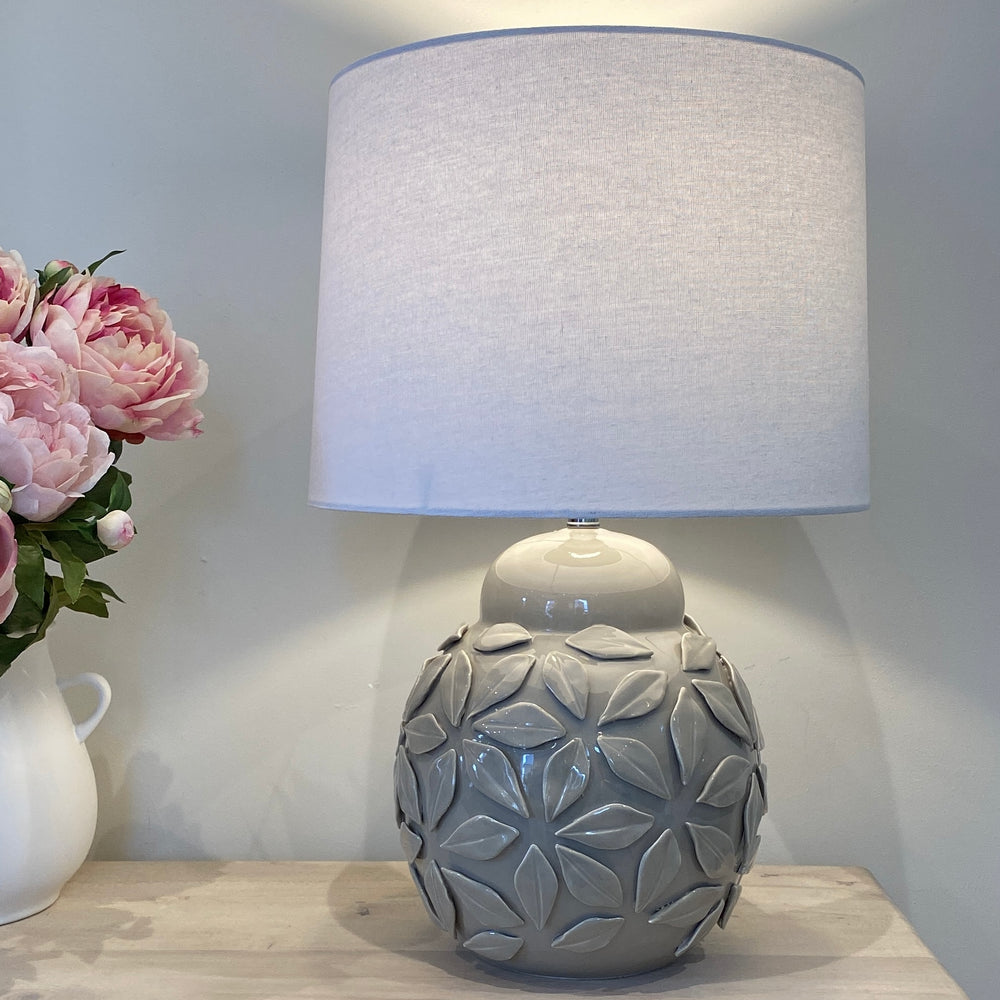 
                      
                        The Fleur Ceramic Grey Lamp & White Linen Shade
                      
                    